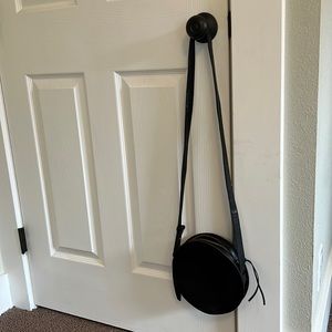 Madewell black leather circle crossbody bag